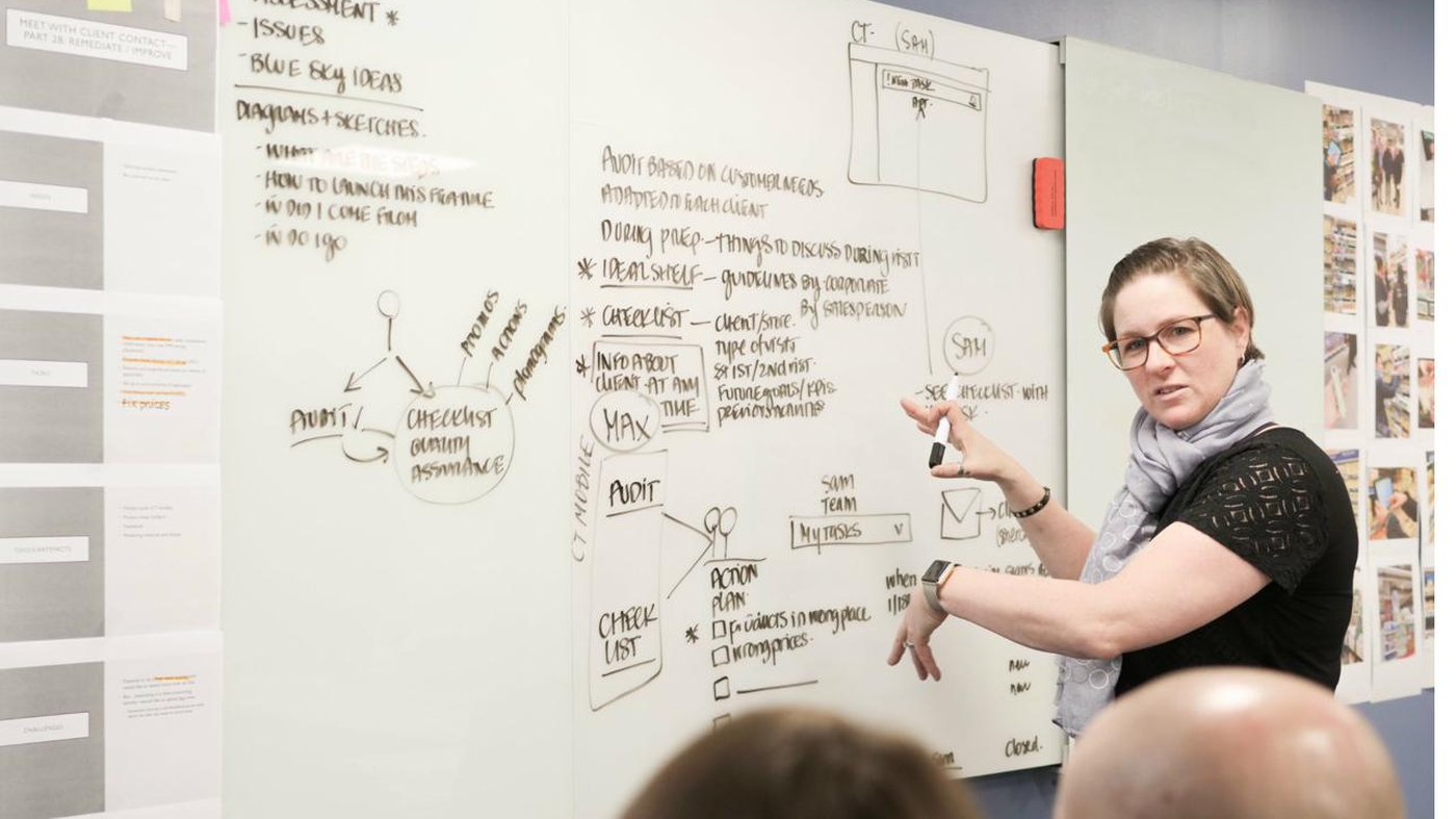 Julie Fortier at the whiteboard